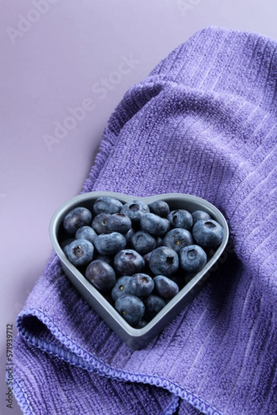 Obraz Fresh blueberries in a heart-shaped bowl.