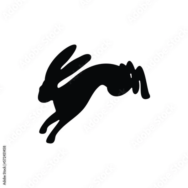 Fototapeta Silhouette of a hopping hare, rabbit, and bunny isolated on white background. Symbol of Easter.