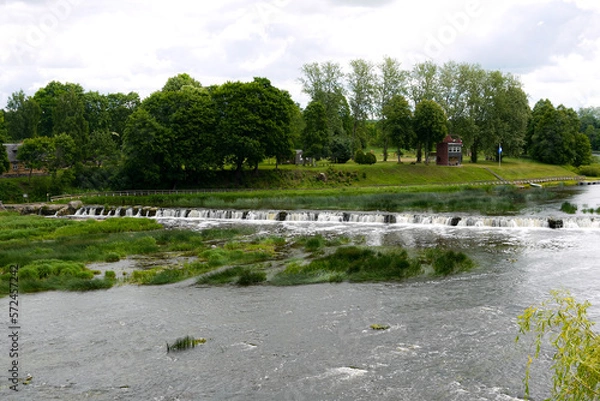 Fototapeta Latvian nature, river and red brick bridge across the river