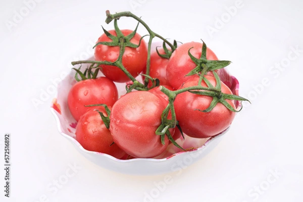 Fototapeta Tomatoes are in the basket, on the white background