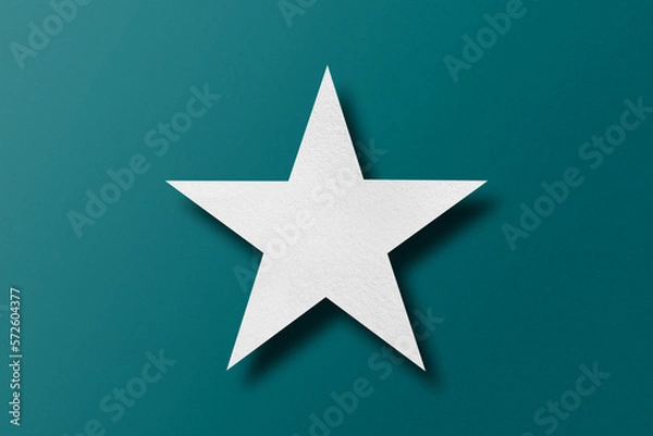 Fototapeta paper cut star shape with light and shadow placed on a green paper background
