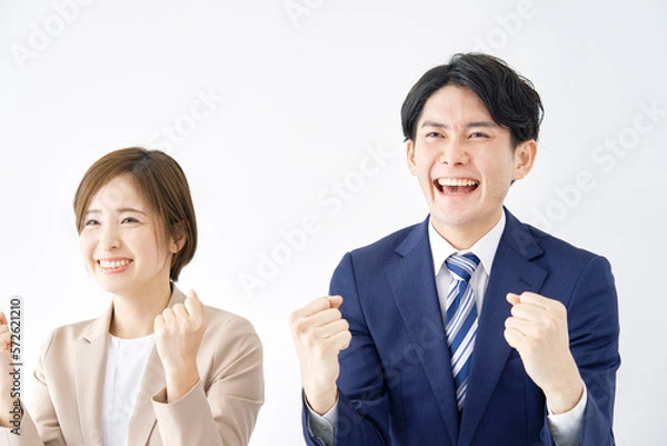 Fototapeta ガッツポーズするビジネスウーマンとビジネスマン　白背景