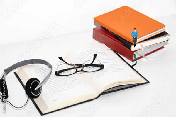 Obraz Open book and naked man's glasses