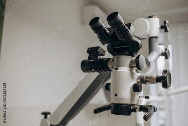 Fototapeta Dental Microscope on a background of a modern clinic closeup.