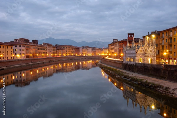 Obraz The nightscape of the river Arno and Santa Maria della Spina in Pisa, Italy. Cloud reflection in the river, night lights and mountains in the background