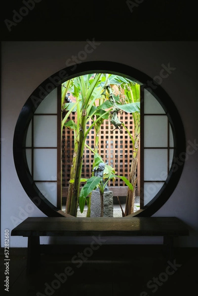 Fototapeta An image of a small Buddha statue in an interior in Japan