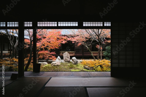 Fototapeta Lone person in an old structure with a garden in Japan