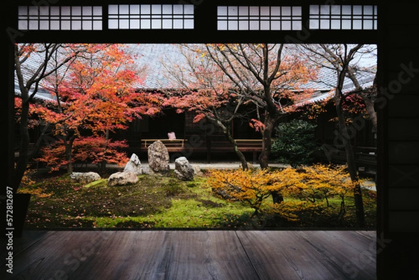 Fototapeta Lone person in an old structure with a garden in Japan