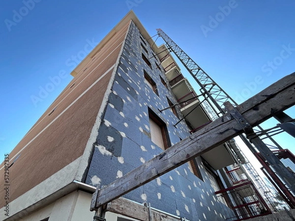 Fototapeta Renovation work on a building to improve thermal efficiency