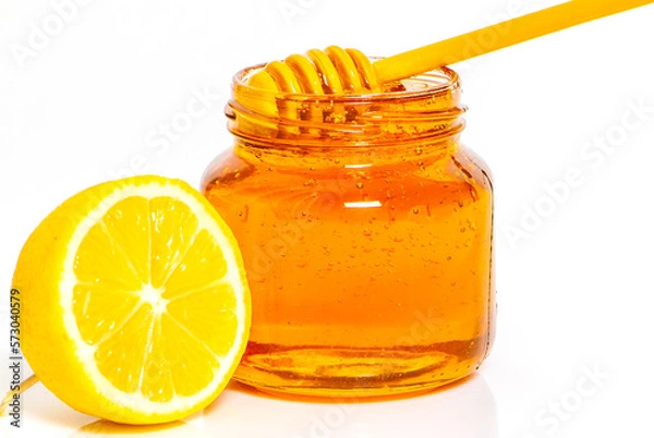 Fototapeta Jar with honey on white background