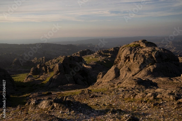 Fototapeta View of Los Gigantes rock massif in Cordoba, Argentina, at sunset. Beautiful light contrast in the rocks.