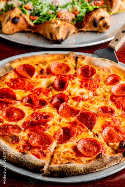 Fototapeta Pizza. Cheese Pizza. Traditional New York City style margarita pizza pie with a thin homemade crispy crust, tomato, garlic, marinara sauce topped with buffalo mozzarella cheese and fresh basil leaves.