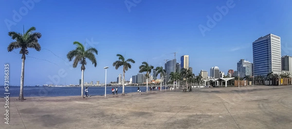 Obraz Panoramic view at the Luanda bay and Luanda marginal, pedestrian pathway with tropical palm trees, downtown lifestyle, Cabo Island, Port of Luanda and modern skyscrapers
