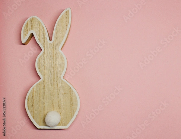 Obraz wooden rabbit on a pink background, colour of the year 2022 , top view on the left, copies space