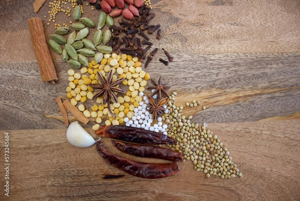 Obraz indian spices on an wooden plate, top view, copy space