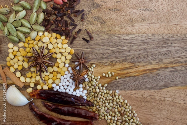 Obraz indian spices on an wooden plate, top view, copy space