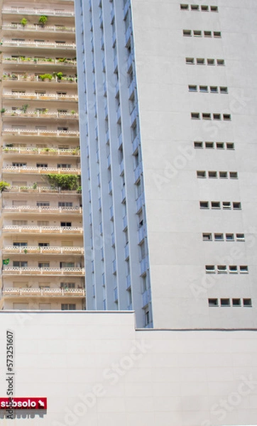 Obraz Two Buildings and a Sign with "undergorund level" written on it (Subsolo) 