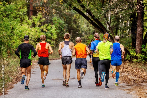 Obraz group athletes man runners running race in autumn park