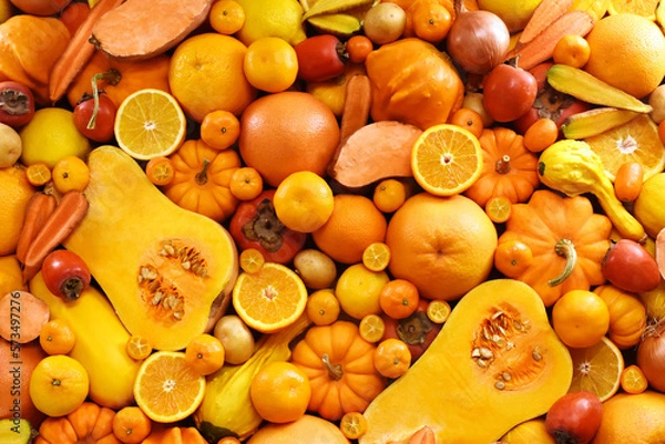 Fototapeta Healthy orange and yellow food high in carotene, fresh ripe bright colorful fruits and vegetables from market, summer farm harvest background