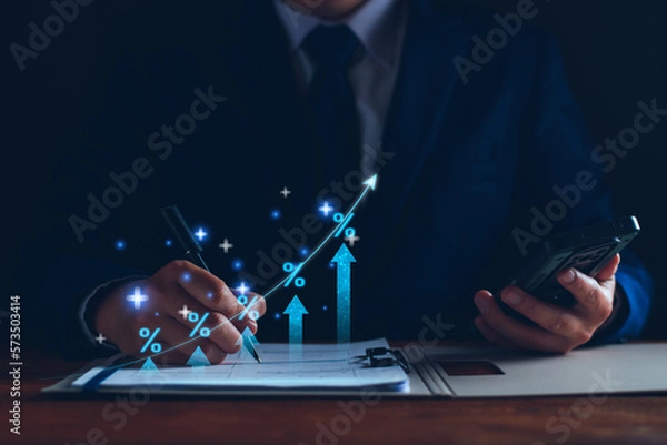 Fototapeta Interest rate and dividend concept. Businessman with percentage symbol and up arrow, Interest rates continue to increase, return on stocks and mutual funds, long term investment for retirement.
