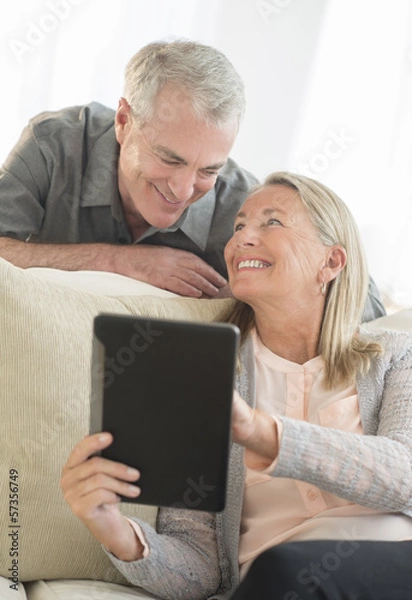 Fototapeta Senior Couple Using Digital Tablet At Home
