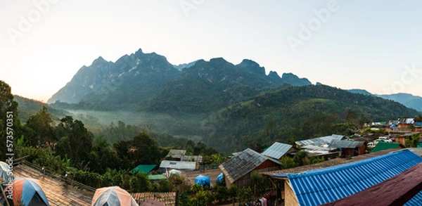 Fototapeta Panoramic view of Doi Luang Chiang Dao, (Doi Chiang Dao) is the third highest peak mountain in Thailand while morning mist flows through the valley area, Chiang Dao District, Chiang Mai, Thailand.