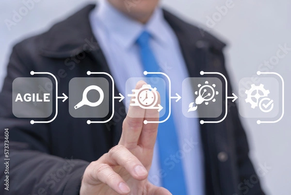 Fototapeta Businessman working on virtual touch screen of future and sees banner: AGILE. Concept of agile development software business web computer.