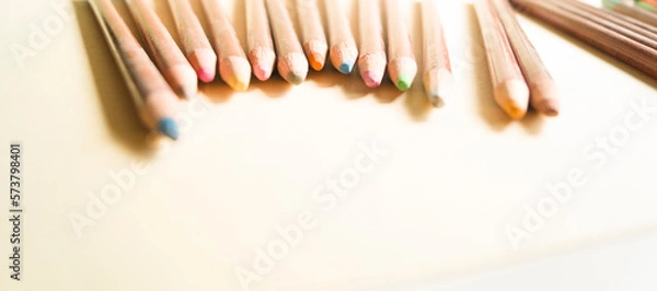 Fototapeta Layout of pastel pencils with space for text. Pastel pencils in a wooden case. Horizontal format