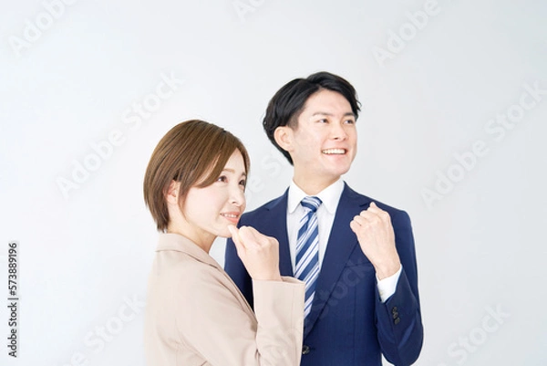 Fototapeta ガッツポーズするビジネスウーマンとビジネスマン　白背景