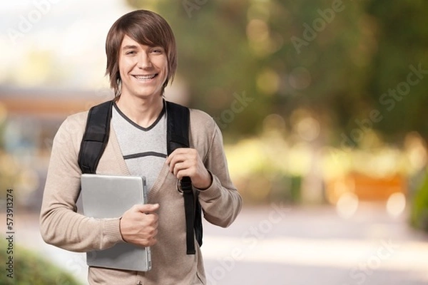 Obraz University young happy student posing in campus