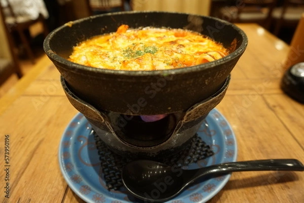 Fototapeta Seafood doria. Doria is a popular Japanese oven baked dish consisting of rice topped with bechamel sauce and grated cheese