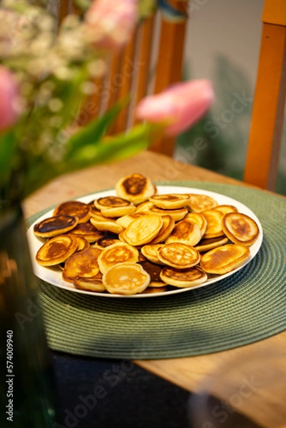 Fototapeta Smal mini pancakes on the table with tulpans, spring colors