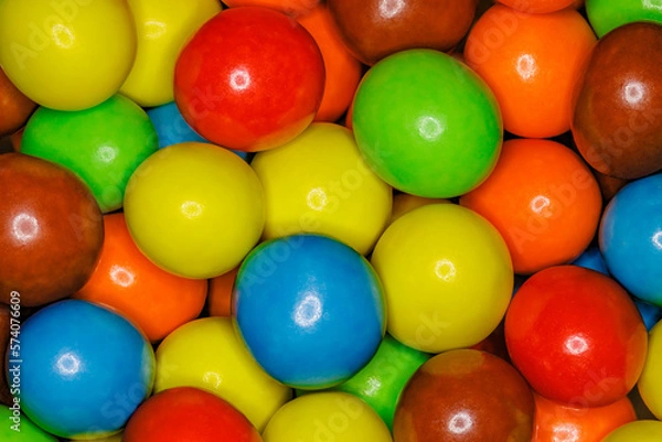 Fototapeta Multi-colored spherical balls candies in bulk close-up, full depth of field background wallpaper, uniform texture pattern