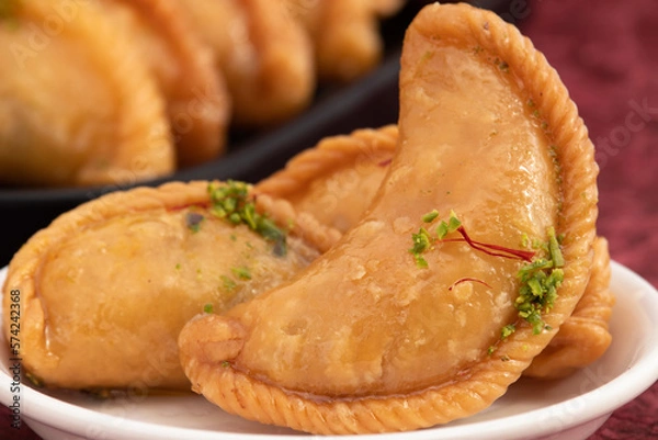 Obraz Gujia Also Called Gujiya, Pirukiya, Pirukia, Pedakiya, Karanji, Basundi Or Gughra Stuffed With Mawa, Khoya, Chasni, Mava, Khoa - Indian Sweet Dumpling Enjoyed On Deepawali, Teez, Holi, Diwali And Teej