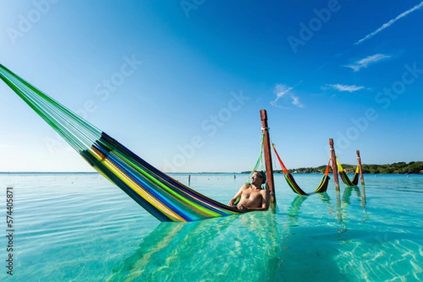 Obraz Man on hammock in Bacalar lagoon Mexico