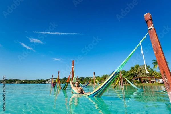 Obraz Man on hammock in Bacalar lagoon Mexico
