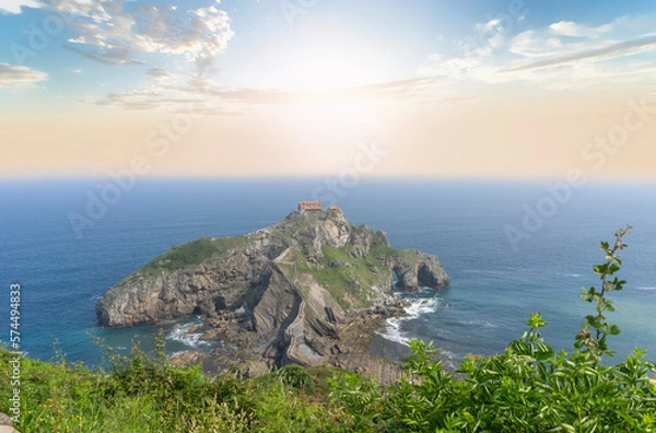 Obraz View from the top of the sunrise mountain to the island of gaztelugatxe in the basque country.