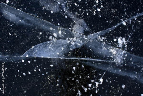 Obraz beautiful cracks in the ice. Volga in winter. Sunset on the winter river
