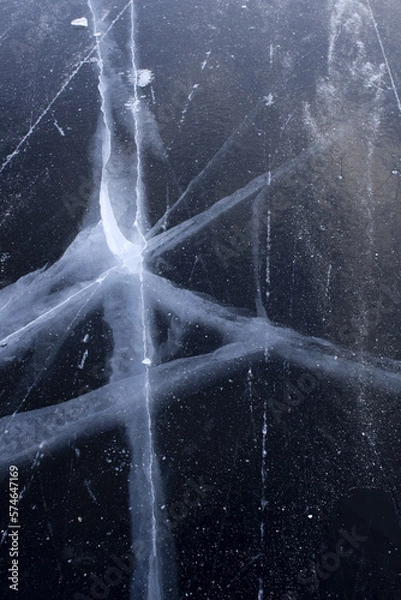 Obraz beautiful cracks in the ice. Volga in winter. Sunset on the winter river