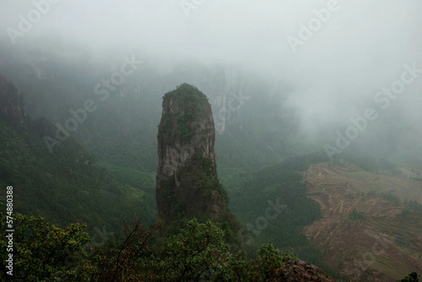 Fototapeta Mountain peak with a very interesting shape in fog