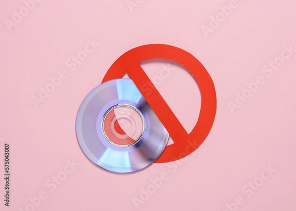 Fototapeta Cd disk with prohibition sign on pink background