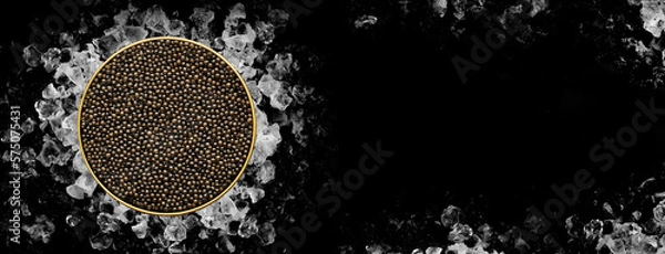 Fototapeta Tin of Caviar on ice on black background on banner format