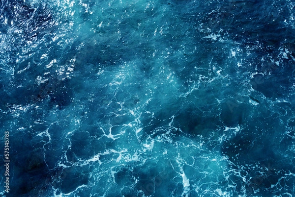 Fototapeta Aerial view of the ocean water surface and waves. Beautiful water background texture for tourism and advertising. Tropical coast