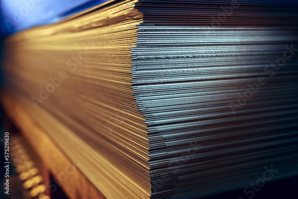 Fototapeta Sheets of metal in a stack in a warehouse