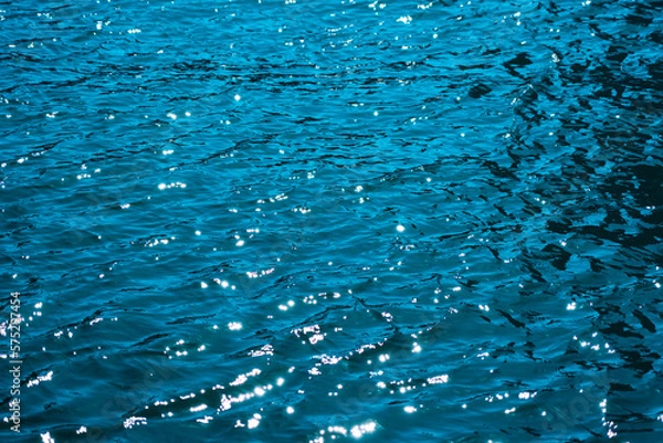 Fototapeta 水面に反射する光