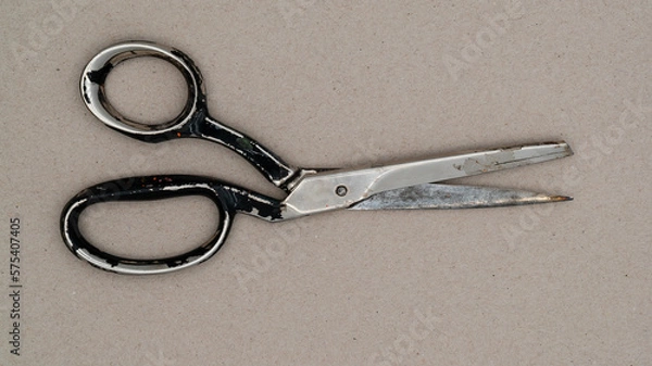 Fototapeta Used old scissors. Top of view of an old scissor.