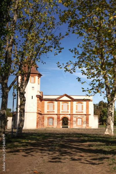 Obraz Façade of an old classic building. Brick architecture. Pediment over the blue sky.