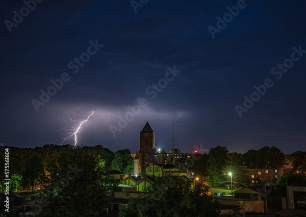 Fototapeta Lightning over church