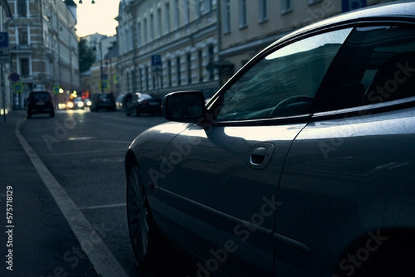 Obraz Сlose-up of a sports car in a blue light on a Moscow street