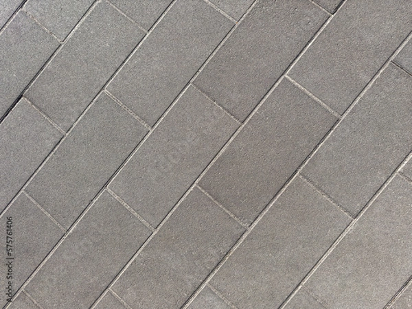 Fototapeta Looking down on cement tile floor